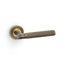 SPITFIRE LEVER ON ROUND ROSE REEDED STYLE ANTIQUE BRASS