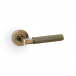 Hurricane Lever on Round Rose Reeded Style Antique Brass
